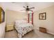 Inviting bedroom with a ceiling fan, a framed painting, and an ocean-themed comforter at 5701 S Macdill Ave, Tampa, FL 33611