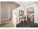 Entryway showcasing hardwood floors, elegant decor, and staircase leading to the second floor at 5701 S Macdill Ave, Tampa, FL 33611