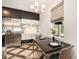 Eat-in kitchen features stainless steel appliances, modern cabinets, and natural light from the window at 5701 S Macdill Ave, Tampa, FL 33611