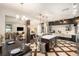 Open concept living space connecting the modern kitchen and cozy living room at 5701 S Macdill Ave, Tampa, FL 33611