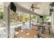 Covered outdoor patio with ceiling fans and views of the backyard pool at 5701 S Macdill Ave, Tampa, FL 33611
