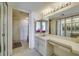 Bathroom features a vanity, walk-in shower, and a large mirror, providing a functional and stylish space at 690 Island Way # 802, Clearwater Beach, FL 33767