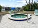 Relaxing hot tub area with chairs and a marina view, perfect for unwinding after a long day at 690 Island Way # 802, Clearwater Beach, FL 33767