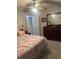 Comfortable bedroom with ceiling fan, a large dresser and mirror, and closet access at 7701 Starkey Rd # 306, Seminole, FL 33777