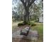Picturesque tree swing set up under a sprawling tree with lush surroundings at 4156 Mcintosh Rd, Dover, FL 33527