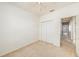 A secondary bedroom featuring neutral carpet and a closet at 1120 Andrew Aviles Cir, Tampa, FL 33619