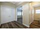 Inviting home entryway featuring beautiful wood flooring, fresh paint, and ample natural light at 16122 Cedar Key Dr, Wimauma, FL 33598