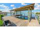 Private boat dock with lift and a covered structure provides convenience and protection for boating enthusiasts at 8839 W Millpoint Rd, Riverview, FL 33578