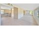 Large living space featuring tile floors, and multiple access points for indoor/outdoor living at 8839 W Millpoint Rd, Riverview, FL 33578