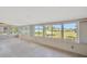 Sunroom overlooking backyard with large windows offering plenty of natural light and lush views at 8839 W Millpoint Rd, Riverview, FL 33578