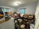 A bedroom needs to be cleaned out and decluttered with boxes and items scattered throughout the room at 916 123Rd Ave, Tampa, FL 33612