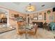 Cozy dining area with a glass table, rattan chairs, and charming decorations at 1110 W Coral St, Tampa, FL 33602