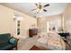 Spacious living room with a ceiling fan and carpeted floor at 1110 W Coral St, Tampa, FL 33602