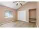 Bright bedroom features a vaulted ceiling, wood-look flooring, a built-in niche and spacious closet at 11938 Royce Waterford Cir, Tampa, FL 33626