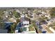 Bird's-eye view of the property featuring a pool, solar panels, and mature landscaping at 1600 Pennsylvania Ne Ave, St Petersburg, FL 33703