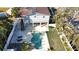 Expansive aerial view showcasing the backyard pool, lush landscaping, and outdoor living spaces at 1600 Pennsylvania Ne Ave, St Petersburg, FL 33703