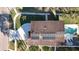 Top-down view of the roof with solar panels, driveway, walkway, and pool in the backyard at 1600 Pennsylvania Ne Ave, St Petersburg, FL 33703
