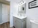 Bathroom featuring beadboard walls, a single sink vanity, and modern fixtures at 1600 Pennsylvania Ne Ave, St Petersburg, FL 33703