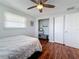 Bedroom featuring laminate flooring, a built in closet, and an overhead fan at 1600 Pennsylvania Ne Ave, St Petersburg, FL 33703