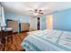Spacious bedroom with wood floors, a ceiling fan, a bathroom and a walk-in closet at 1600 Pennsylvania Ne Ave, St Petersburg, FL 33703