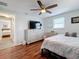 Bedroom features laminate flooring, an overhead fan, and an abundance of natural light at 1600 Pennsylvania Ne Ave, St Petersburg, FL 33703