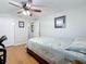 Cozy bedroom features a double bed, laminate floors, and a neutral color palette at 1600 Pennsylvania Ne Ave, St Petersburg, FL 33703
