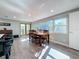Bright dining area with large windows, hardwood floors, and direct access to the outside at 1600 Pennsylvania Ne Ave, St Petersburg, FL 33703