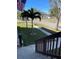 Street view from front entrance of home featuring manicured front lawn, sidewalk and palm trees at 1600 Pennsylvania Ne Ave, St Petersburg, FL 33703