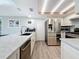 Bright kitchen featuring stainless steel appliances, granite countertops, and ample cabinet space at 1600 Pennsylvania Ne Ave, St Petersburg, FL 33703