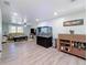 Open-concept living room with a large aquarium and hardwood floors at 1600 Pennsylvania Ne Ave, St Petersburg, FL 33703