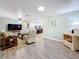 Spacious living room boasting modern flooring and neutral decor, perfect for relaxation and entertainment at 1600 Pennsylvania Ne Ave, St Petersburg, FL 33703