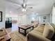 Expansive living room with an open floor plan, wood-look floors, and comfortable seating arrangements at 1600 Pennsylvania Ne Ave, St Petersburg, FL 33703