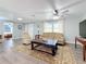 Spacious living room offering plenty of natural light and an open layout with wood-look flooring at 1600 Pennsylvania Ne Ave, St Petersburg, FL 33703