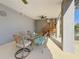 Covered patio featuring outdoor dining set, ceiling fan, and convenient stair access at 1600 Pennsylvania Ne Ave, St Petersburg, FL 33703