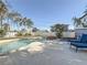 Gorgeous pool and lounge area surrounded by lush palm trees, creating a serene backyard oasis at 1600 Pennsylvania Ne Ave, St Petersburg, FL 33703