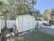 Functional shed nestled in the backyard, perfect for storage, with pool in the background at 1600 Pennsylvania Ne Ave, St Petersburg, FL 33703