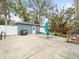 Spacious backyard with patio area, white fence, grill, and lots of space at 320 N Madison Ave, Clearwater, FL 33755