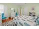 Bedroom with lots of natural light, hard wood flooring, and light green walls at 320 N Madison Ave, Clearwater, FL 33755