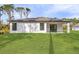 A large yard behind the house offers plenty of space for outdoor living at 3355 Moncrief Ave, North Port, FL 34286