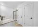 Modern bathroom featuring a marble countertop, and glass shower door at 3355 Moncrief Ave, North Port, FL 34286