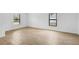 Bright bedroom featuring tile flooring, and multiple windows at 3355 Moncrief Ave, North Port, FL 34286