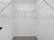 Walk-in closet with metal shelving and a carpeted floor at 3355 Moncrief Ave, North Port, FL 34286