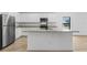 A kitchen with stainless steel appliances and a center island at 3355 Moncrief Ave, North Port, FL 34286