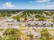 Aerial view of modern townhomes, showing the neighborhood and skyline in the distance at 460 87Th Avenue North, St Petersburg, FL 33702