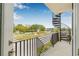 Balcony view with spiral staircase showcases outdoor living space and neighborhood scenery at 460 87Th Avenue North, St Petersburg, FL 33702