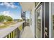 This balcony features an outdoor spiral staircase, and a view of the neighborhood at 460 87Th Avenue North, St Petersburg, FL 33702