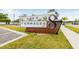 Terraces at 87 community sign featuring modern architectural design and lush landscaping at 460 87Th Avenue North, St Petersburg, FL 33702