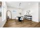 Bright dining room with modern decor, hardwood floors, accent lamps and large mirror at 460 87Th Avenue North, St Petersburg, FL 33702