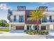 Modern townhomes boast rooftop decks, private balconies, spiral staircases, and attached garages in the lovely exterior view at 460 87Th Avenue North, St Petersburg, FL 33702