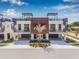 Modern townhomes boasting rooftop decks, spiral staircases, covered parking, and stylish wood facade at 460 87Th Avenue North, St Petersburg, FL 33702